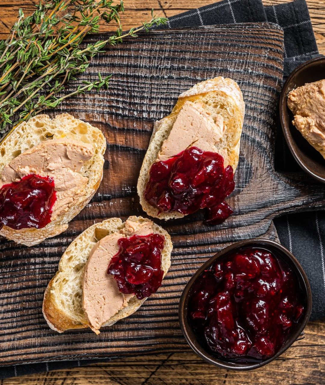 French cuisine Foie gras toasts, goose liver pate and lingonberry marmalade.